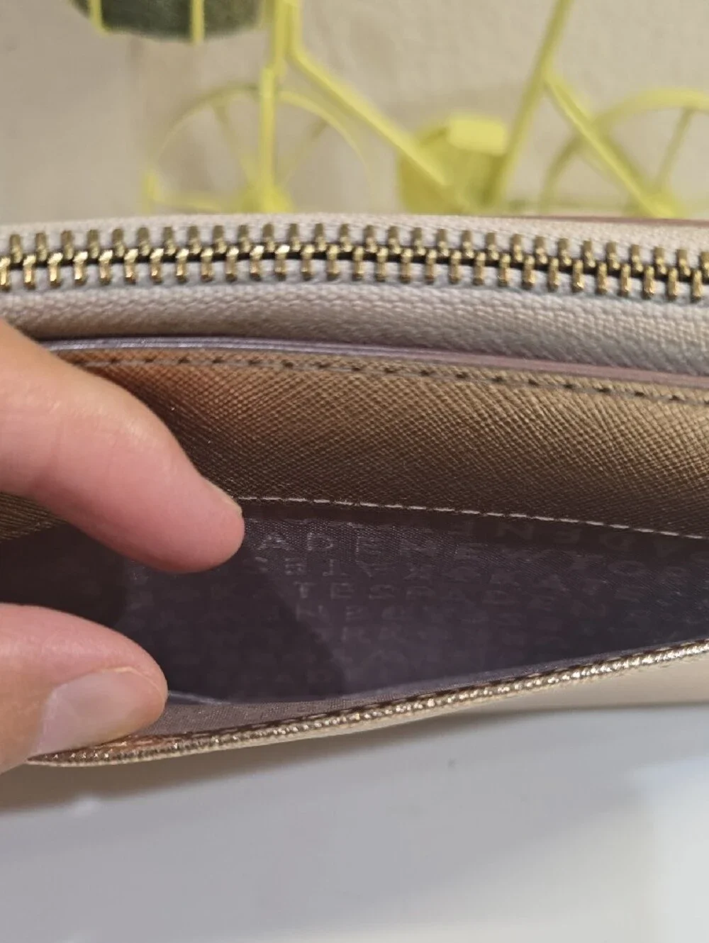 kate spade metallic rose gold zip-around continental wallet